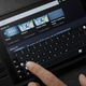 A person types in a search term for their Steam library using the Steam Deck's virtual keyboard.